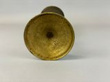 an image of a brass vase on a white surface