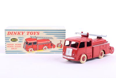 a red toy fire truck with a box in the background