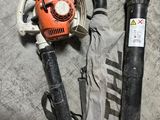 an image of a blower and a hose on the floor