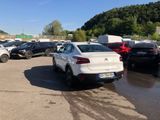 a lot of cars that are parked in a lot
