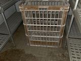 a metal cage in the middle of a dirty room