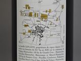 a bottle of wine that has a map on it