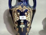 two vases that are sitting side by side