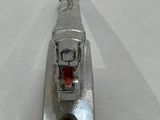 a metal object that is sitting on a white surface