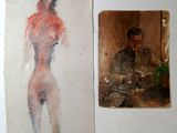 two paintings of a man and a woman are hanging on a wall