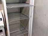 an image of a refrigerator in a kitchen with the door open