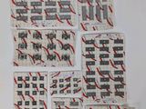 several pieces of paper with red and black designs on them