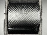 a close up of a watch in a box on a table