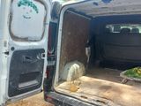 a white van with the door open on the side of the road