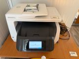 a printer sitting on top of a desk next to a banana