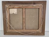 an old picture frame with a piece of paper taped to the side of it
