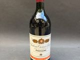 a bottle of wine that is sitting on a table