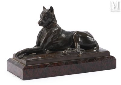 statue of a dog laying down on a marble base on a white background