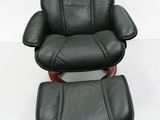 an image of a black leather recliner chair and ottoman