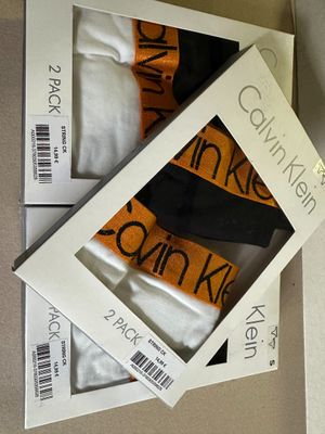 boxes of three pairs of socks in a box on a table