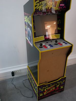a video game machine that is sitting on the floor