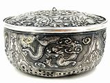 an image of a silver box with a dragon design on it