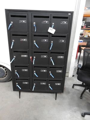 a black filing cabinet with a bunch of keys on it