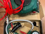 a box with a compressor and a hose in it
