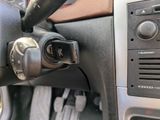 a close up of a steering control in a car