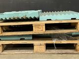 wooden pallets stacked on top of each other on a floor