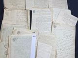 a pile of old papers sitting on a table