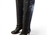 a close up of a pair of black boots on a white background