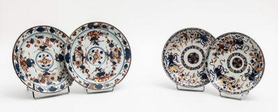 three plates with different designs on them on a white surface