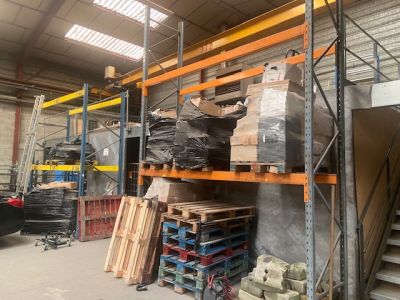 a large warehouse with a lot of pallets on the shelves