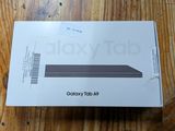 the box is open on a wooden table with a wooden floor