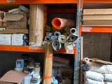 a room with a lot of boxes and supplies on the shelves