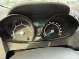 a close up of a car dashboard with a speedometer and gauges