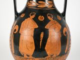 a black and orange vase with two figures on it