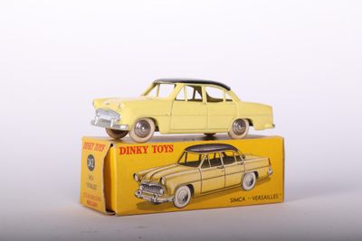 a yellow toy car sitting on top of a yellow box