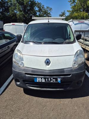 a white van that is parked in a parking lot