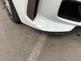 a close up of a car ' s front bumper