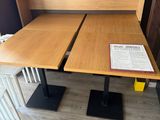 two tables that are set up in the corner of the room