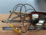 a small machine that is sitting on top of a wooden pallet
