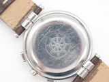 an image of a close up of a watch on a white surface