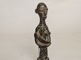 an image of a statue of a woman holding a baby