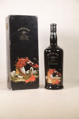 an image of a bottle of whisky sitting next to a box