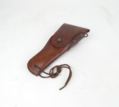 brown leather sheath for a knife on a white surface