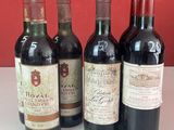 plusieurs bouteilles de vin sont alignées sur un comptoir
