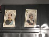 three cards on the wall of a room with a clock