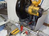 a picture of a machine that is working on a piece of metal