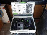 a tool box with tools inside of it on the floor