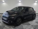 the black citrole is parked on a checkered tile floor