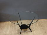 an image of a glass coffee table on a wooden floor
