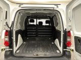 the back of a white van with the doors open and the back of it ' s cargo door open