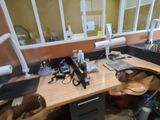 a desk with a computer and a laptop on it